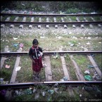 Girl on train tracks, India