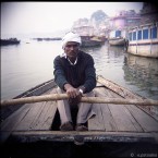 Man on a boat in Ganges river, Varanasi, India